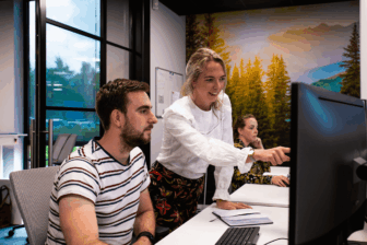 Project management employees discussing an av production.