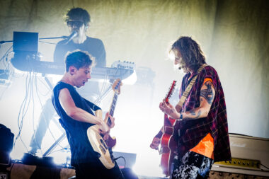 Guitarists performing during show