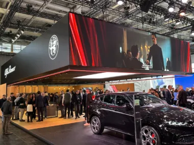 Hanging squared video banner above exhibition stand